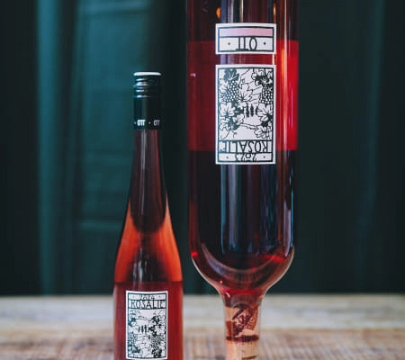 Two bottles of rosé wine with decorative labels