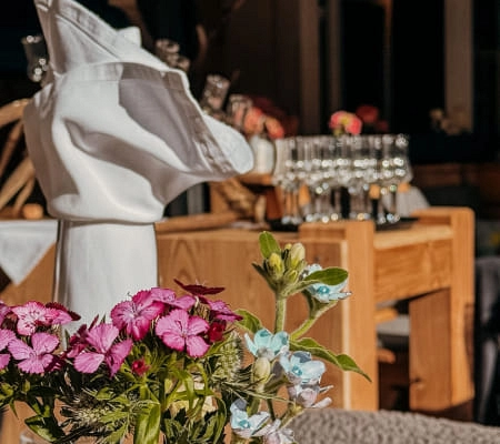 Table setting with flowers and glasses in a dining area